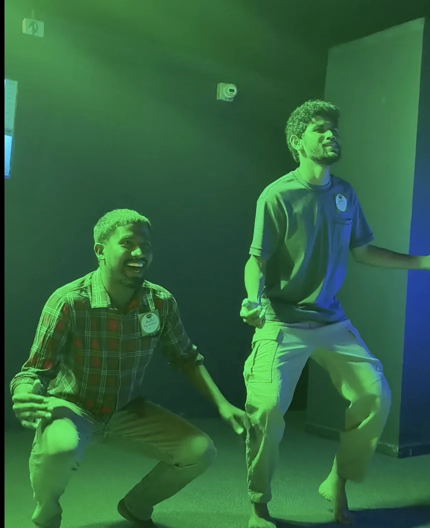 Two players mid-challenge under green lights